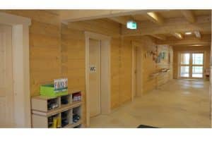 Kindergrippe für die Firma Hipp in natürlicher Holzbauweise als Blockhaus